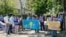 Protesters demand the return of their relatives from China outside the consulate in Almaty on May 18. 