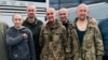 Former Kherson Mayor Volodymyr Mykolayenko (center) with other Ukrainian prisoners of war after his release from Russian captivity on August 24. 