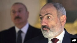 Russia - Armenian Prime Minister Nikol Pashinian and Azerbaijan's President Ilham Aliyev listen to a guide during a visit to the Catherine Palace on the sidelines of CIS summit in St. Petersburg, December 26, 2023.