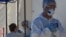 Kazakhstan - Medical specialists wearing protective equipment work at the coronavirus disease (COVID-19) testing facility in Almaty, Kazakhstan July 8, 2020. REUTERS/Mariya Gordeyeva