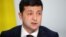 Ukraine's President Volodymyr Zelenskiy speaks during a press conference after the Paris summit. Activists in Ukraine says Zelenskiy crossed no “red lines” in his talks with Putin.