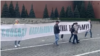 Protesters unfurl a banner on Red Square on September 15.