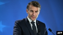 France's President Emmanuel Macron holds a press conference after working sessions at the European Council in Brussels on June 26, 2025.