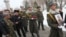 Armenia - An honor guard holds the picture of Sergeant Armen Hovannisian during his state funeral in Yerevan's Yerablur military cemetery, 22Jan2014.