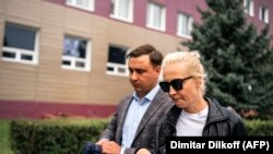 Олег Жданов жана Юлия Навальная.