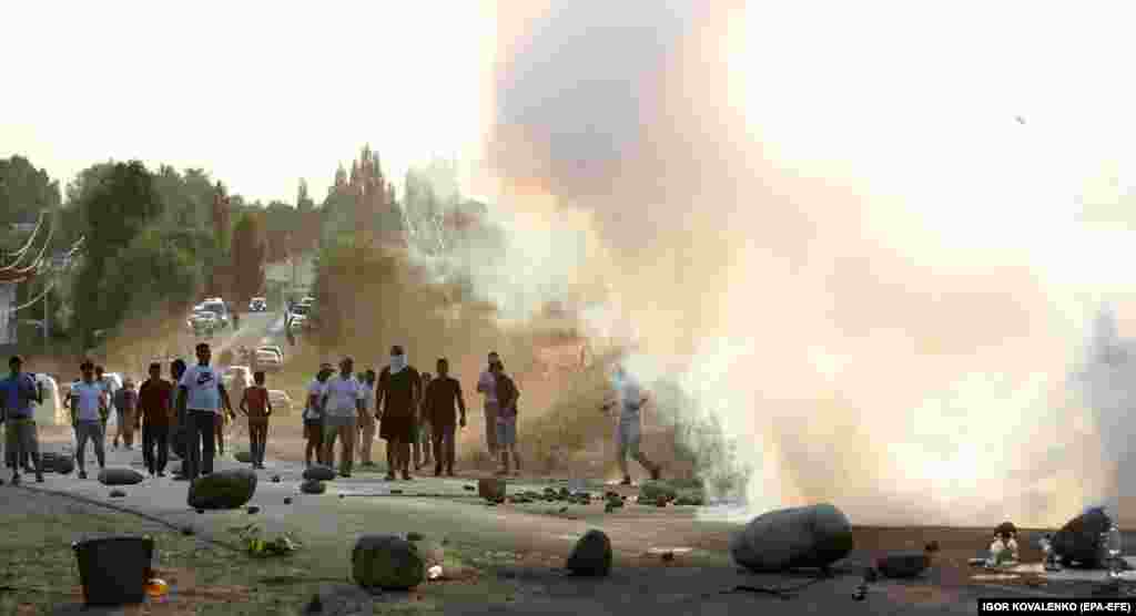 Atambaev supporters at a road leading towards the compound.&nbsp;