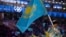 Знаменосец казахстанской сборной Ердос Ахмадиев на на церемонии открытия Олимпиады в Сочи. 7 февраля 2014 года.  