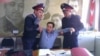 Полицейские проводят задержание гражданского активиста Ермека Нарымбаева. Алматы, 17 октября 2014 года. 