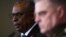 U.S. Secretary of Defense Lloyd Austin (left) and the chairman of the U.S. Joint Chiefs of Staff, General Mark A. Milley, speak to reporters in Germany on January 20.
