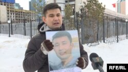 Baibolat Kunbolatuly protests in front of the Chinese Embassy in Nur-Sultan in February 2020. “I think about what would happen to my children if I were to die [in prison]," he says. 