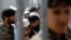 Prisoners stand in line for release during a ceremony handing over the Bagram prison to Afghan authorities at the U.S. air base north of Kabul in March 2013.