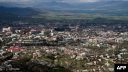 The Azerbaijani side has warned it could shell the capital of Karabakh, Stepanakert, if alleged attacks on Azerbaijani settlements are not halted, but it batted away Armenian-backed separatists' suggestion that it had targeted civilians.