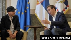 Ralph Fiennes (left) received Serbian citizenship and an ID card from President Aleksandar Vucic in Belgrade on September 24.