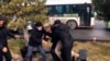 Plainclothes security officers detain protesters during demonstrations over fuel prices in Shymkent in early January.