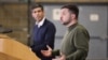 Ukrainian President Volodymyr Zelenskiy (right) and U.K. Prime Minister Rishi Sunak hold a news conference at an army camp in Dorset on February 8. 
