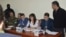 Nagorno Karabakh - Shahbaz Quliyev (R) and Dilgam Askerov (third from L), Azerbaijani men charged by Karabakh's authorities with sabotage, stand trial in Stepanakert,27Oct,2014