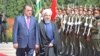 Tajik President Emomali Rahmon (left) welcomes Iranian President Hassan Rohani in Dushanbe.