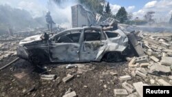 A firefighter works in a residential area damaged by a Russian missile strike in Kramatorsk in Ukraine's Donetsk region. 