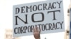 Демократия, а не корпоратократия - один из лозунгов движения "Займи Уолл-стрит" в Лос-Анджелесе