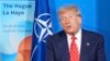 US President Donald Trump talks to reporters at the NATO summit in The Hague this week. 