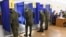 Servicemen vote in the 2021 Russian parliamentary election at polling station No 202 at secondary school No 10 in the village of Peschanka