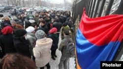 Armenians protest in front of the National Assembly building against the ratification of the controversial gas agreement with Russia in Yerevan on December 23.