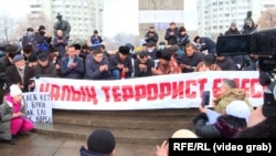 Opposition groups hold a rally in Almaty on February 13, 2022, to honor the victims of the January 2022 crackdown on anti-government protests in the country and demand accountability for the violations of human rights.