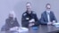 Aleksei Navalny (center) is seen on a video link from inside the Correctional Labor Colony No. 2 in the town of Pokrov, east of Moscow, in February.