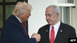 US President Donald Trump shakes hands with Israeli Prime Minister Benjamin Netanyahu in Washington, D.C., on April 7.