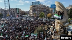 A drone view shows people celebrating in Aleppo after rebel fighters ousted Syria's Bashar al-Assad, December 13, 2024.