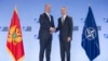 NATO Secretary-General Jens Stoltenberg (right) meets with Montenegrin President Milo Dukanovic in Brussels on June 4.