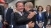 Gerhard Schroeder (left) hugs Russian President Vladimir Putin at the opening of the 2018 FIFA World Cup in Moscow in June 2018.