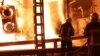 Firefighters work to put out a fire at an energy infrastructure facility damaged by a Russian drone strike at an undisclosed location in Ukraine on October 27.