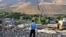 Iran -- A man looks at damaged houses in the earthquake-stricken village of Varzaqan near Ahar, in East Azerbaijan province, 12Aug2012