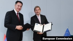 Եվրամիության հանձնակատար Յոհանես Հան, Հայաստանի էկոնոմիկայի նախարար Կարեն Ճշմարիտյան