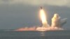 Russia Test Fires Ballistic Missiles From Subs GRAB