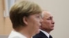 Володимир Путін та Ангела Меркель