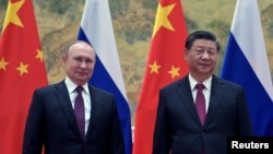 Владимир Путин жана Си Цзиньпин.
