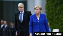Борис Джонсон и Ангела Меркель