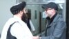 امیر خان متقي له امريکايي چارواکي ایډم بویلر سره په کابل کې د ملاقات په حال کې 