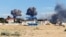 Дым от взрывов на военном аэродроме в поселке Новофедоровка вблизи города Саки в оккупированном Крыму, 9 августа 2022 года