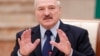 Belarusian President Alyaksandr Lukashenka reacts during a meeting with the media in Minsk on December 14. 