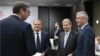 Serbian President Aleksander Vucic (left) speaks with Kosovar President Hashim Thaci (right) next to European Commissioner for European Neighborhood Policy Johannes Hahn (2nd right) and European Council President Donald Tusk during the EU-Western Balkans summit last month.