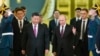 Russian President Vladimir Putin (center right) welcomes his Chinese counterpart, Xi Jinping (center left), for talks at the Kremlin in June. 
