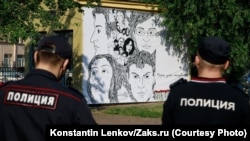 Witnesses said the poster was removed after hanging in position for several hours.