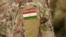 Tajikistan flag on soldiers arm (collage).