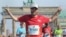 Jared Goldman finishing marathon in Berlin