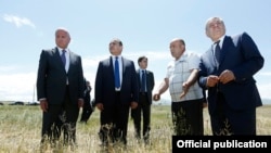 Armenia - Prime Minister Hovik Abrahamian (second from left) inspects a wheat field in Shirak province seriously damaged by a hailstorm, 9Jul2014