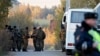 Russia -- Russian police block the road to the house of Amiran Georgadze who is suspected in murdering four people, in the village of Timoshkino, some 27 km from the town of Krasnogorsk in the Moscow region, October 20, 2015