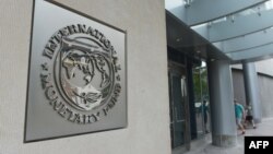 U.S. -- A sign at the entrance to the International Monetary Fund building in Washington.